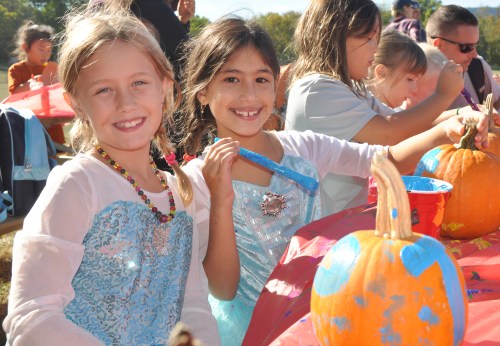 Tierney Reed and Priya Crystal paint pumpkins at last Saturday's New Paltz Central School District's Foundation for Student Enhancement kids event at the Field of Dreams.